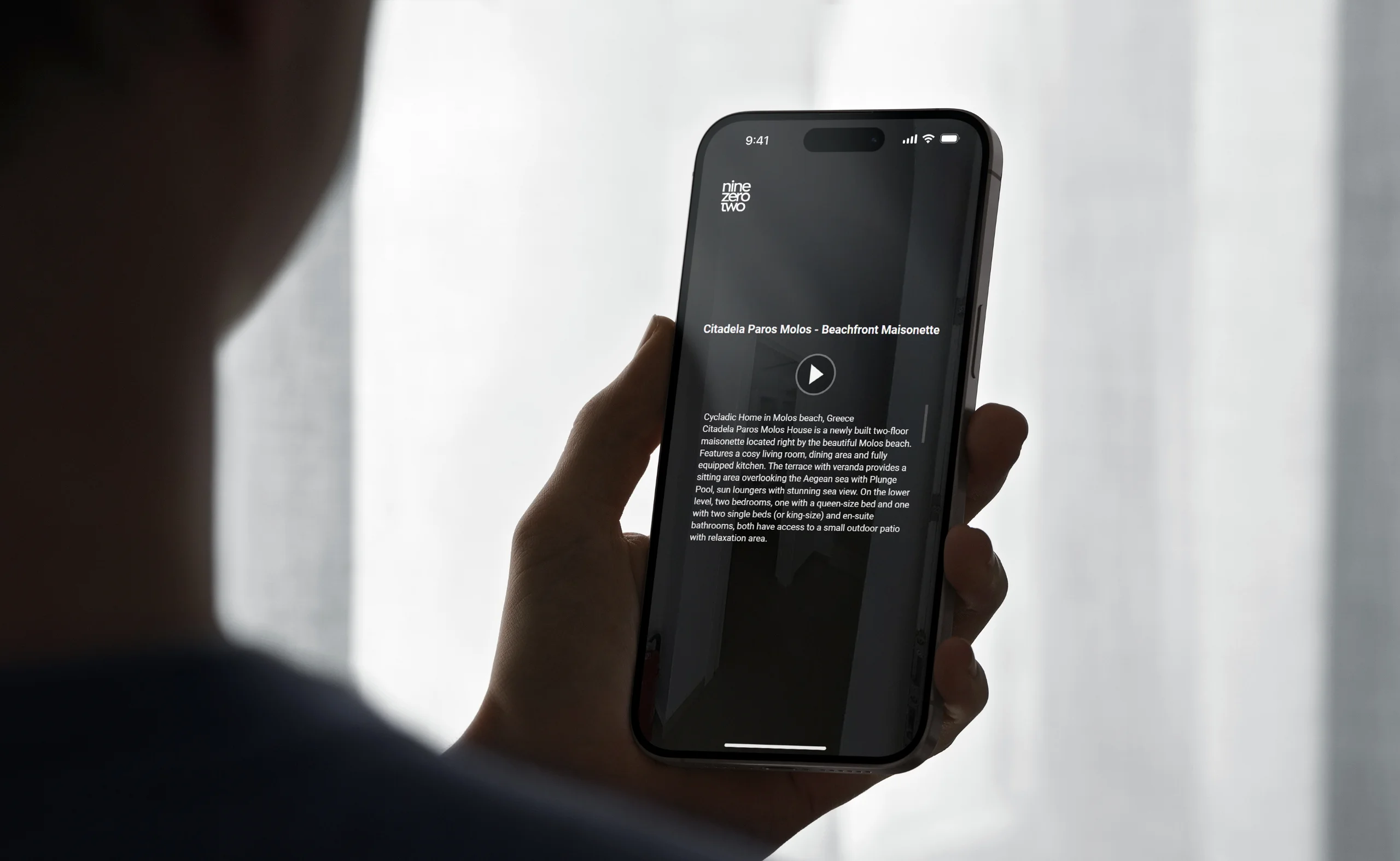 Man holds iPhone 14 Max watching a virtual tour