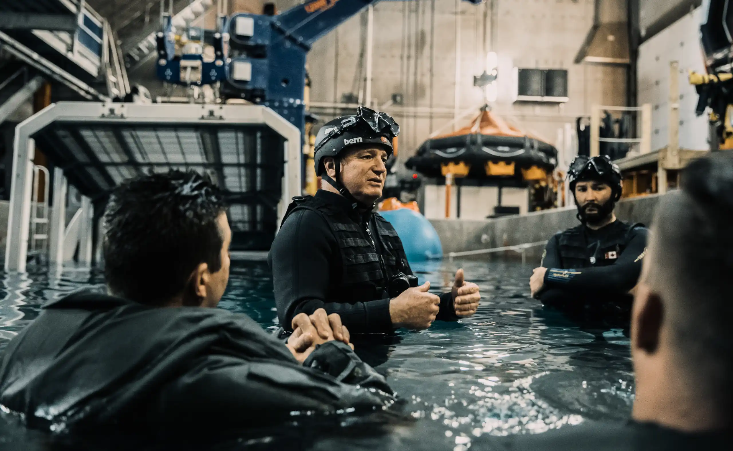 RUET instructor briefing trainees in the pool